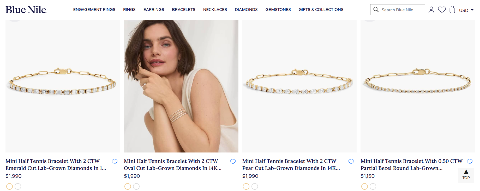 A collection of Blue Nile mini half tennis bracelets featuring 14K yellow gold designs with emerald, oval, pear, and round cut lab grown diamonds