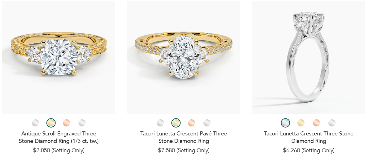 Three-stone diamond engagement rings in yellow and white gold, featuring vintage engraved and pavé settings with round center diamonds