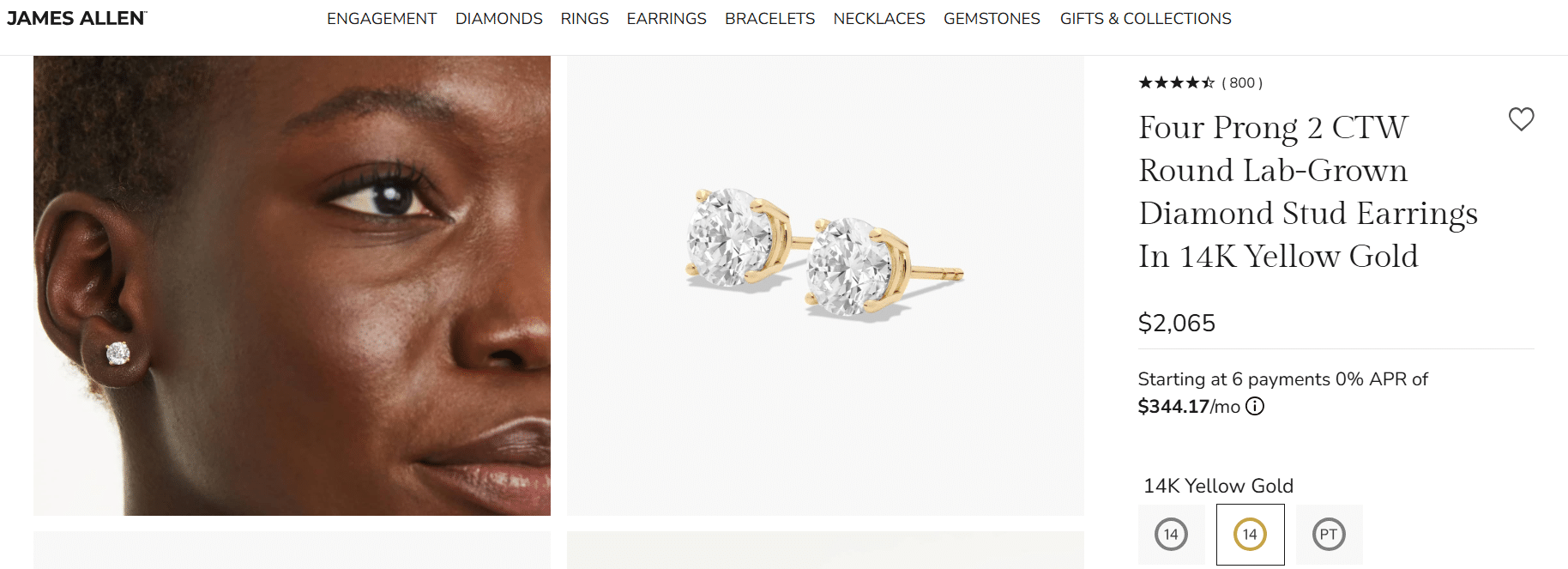 Round cut lab-grown diamond four prong stud earrings in 14k yellow gold worn on ear